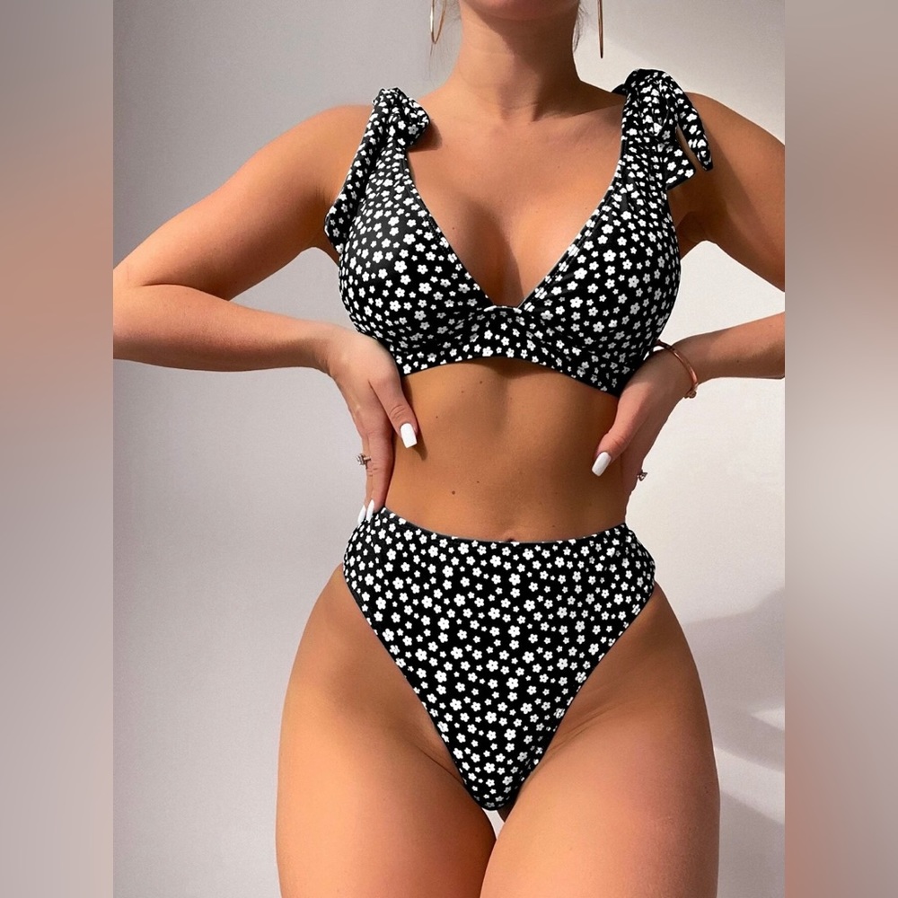 Black bikini with white flowers on it